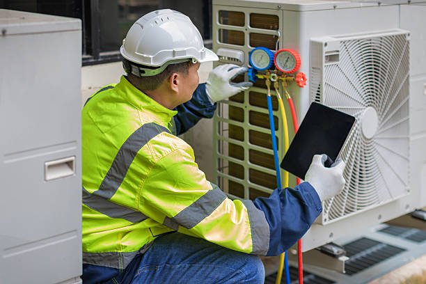 Professional Heat Pump Repair technician working in Perris, CA